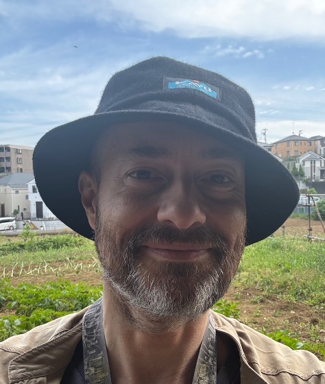 Lantern's founder standing by a Tokyo allotment garden